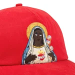 denim-tears-black-mary-red-cap