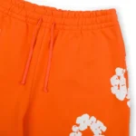 denim-tears-cotton-wreath-baggy-orange-sweatpant-2